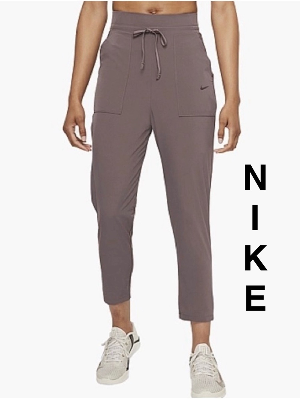 Nike | Bliss Luxe 7/8 Women's Training Pants in a dusty rose/pink - Size Large